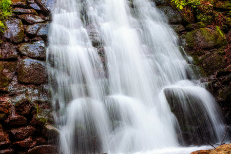 beautiful waterfall in the Cindrel mountains of Romaniaの写真素材