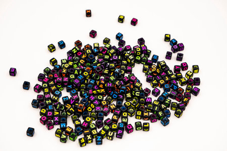 black square beads with letters on white backgroundの写真素材