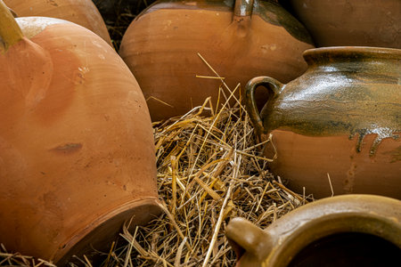 clay pots on dry strawの写真素材