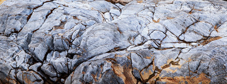 big stone texture eroded by the river waterの写真素材