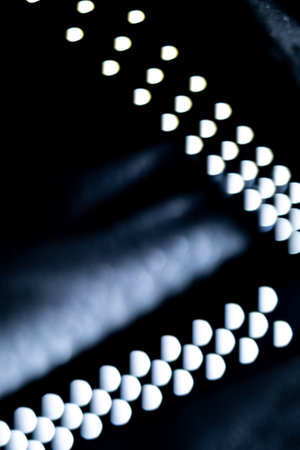 blured defocused led lights on dark backgroundの写真素材