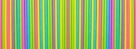 Close up many colored paper straw pattern background. Flat lay cocktail tube abstract vertical line textureの写真素材