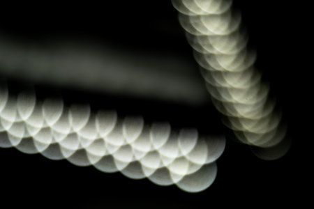 blured defocused led lights on dark backgroundの写真素材