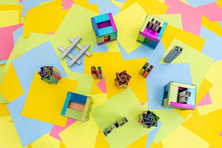 creativity to make staples in different forms with a background of multicolored paper sticky notesの写真素材