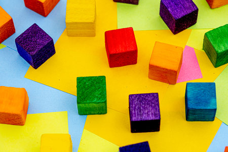 Colorful wood block with a background of multicolored paper sticky notesの写真素材