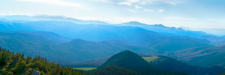 Hazy sun over the mountains peaks, Bratocea pass, Ciucas mountains, Brasov county, Romania, 1720m