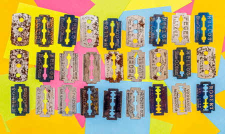 old vintage razor shaving blade on multicolored paper sticky notesの写真素材