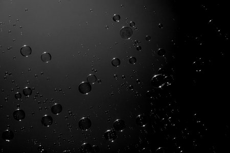 Soap bubbles on the dark backgroundの写真素材