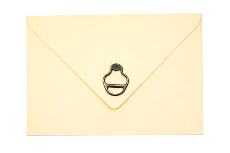 vintage paper envelope with old metallic soda Can ring pull isolated on the whiteの写真素材
