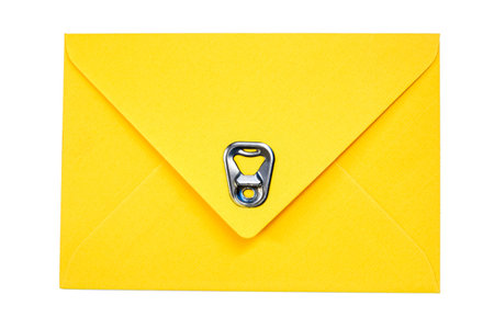 yellow vintage paper envelope with old metallic soda Can ring pull  isolated on the whiteの写真素材