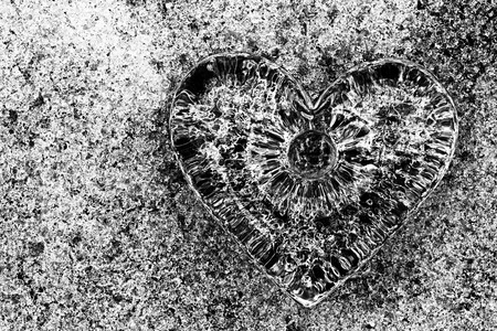 Glass heart on crystalline snowの写真素材