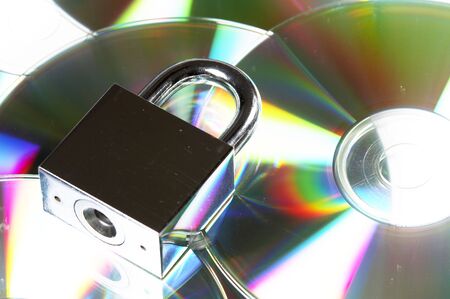 concept data security with padlock on CD discの写真素材