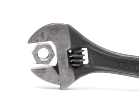 Wrench and bolt on the white backgroundの写真素材