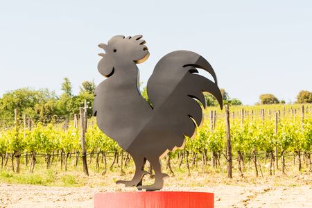 The symbol of the Chianti Classico wine along a road in Tuscanyの写真素材