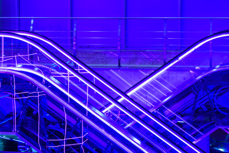 Colorful escalators  lit by  neonsの写真素材