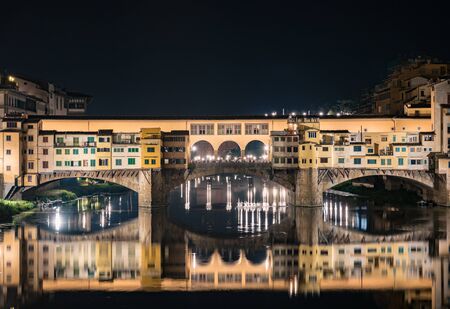 Night view of the famous bridge of "Ponte Vecchio" in Florence, Italyの写真素材