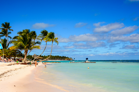 PUNTA CANA, DOMINICAN REPUBLIC - JANUARY 16, 2016 - Children and adult have fun and relaxing in a beautiful caribbean beach in Punta Canaのeditorial素材