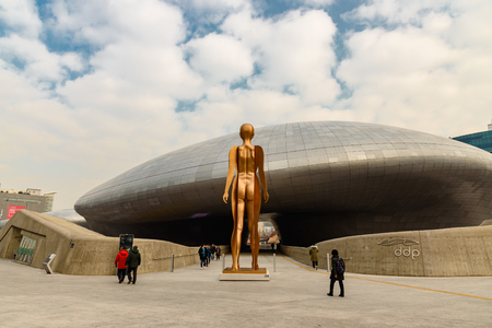 SEOUL, SOUTH KOREA - DECEMBER 31, 2016 - People walking near the entrance of Dongdaemun Design Plaza in Seoulのeditorial素材