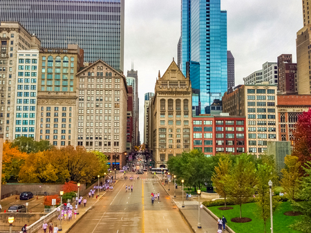 CHICAGO, ILLINOIS - OCTOBER 15, 2012 - A crowded street of Chicago with people walking after a running event.のeditorial素材
