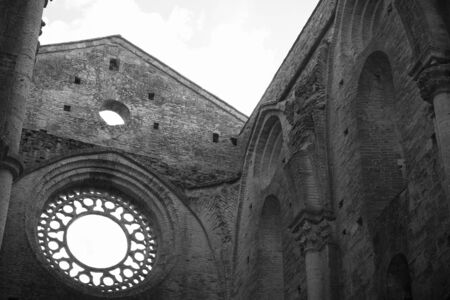Black and white photo of the interior of the famous Abbey of San Galgano in Chiusdino, Tuscany, Italyの写真素材
