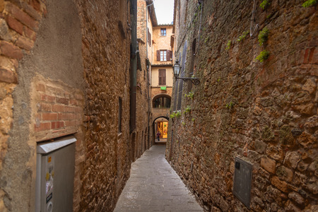VOLTERRA, ITALY - APRIL 23, 2017 - View of a street of the small and famous town of Volterra, Italy.のeditorial素材