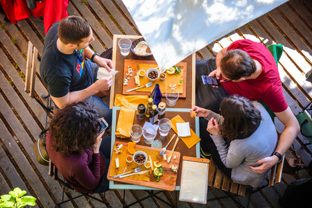 MANAROLA, ITALY - APRIL 29, 2017 - Some tourists have lunch at a restaurant in the center of the famous town of Manarola in the Cinque Terre National Park.のeditorial素材