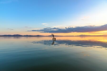 PASSIGNANO SUL TRASIMENO, ITALY - OCTOBER 23, 2017 - A sculpture in the middle of Lake Trasimeno in Passignano in Umbria dedicated to the âFrecce Tricoloriâ of Italian military aircraftのeditorial素材