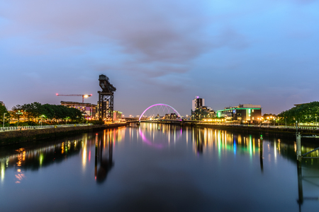 Night lights and the iconic Clyde Arc Bridge at Glasgow City in Scotland over river.のeditorial素材