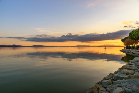 Scenic view of the Lake Trasimeno, Umbria, Italy at sunsetの写真素材