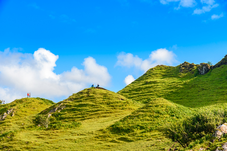Isle of Skye, Scotland - August 12, 2017: Tourist hiking the Mystic Fairy Glen, a romantic green valley in the Isle of Skye.のeditorial素材