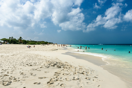 Oranjestad, Aruba - January 4 2018: Tourists relax along the Eagle Beach of Arubaのeditorial素材