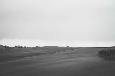 View of a soft, plowed field in spring. Black and white photo.の写真素材