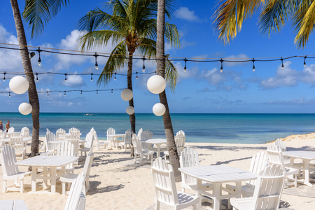 Tropical beach with white sands and table near the shores of the Caribbean Sea.の写真素材