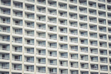 Close up of the windows of a white buildingの写真素材