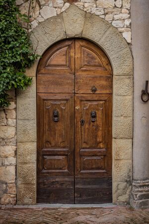 Vertine, Italy - November 4, 2019:Close up of an ancient door in the idyllic and famous town of Vertine in the heart of Chianti areaのeditorial素材