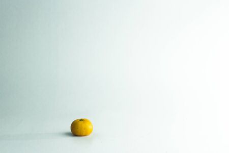 Orange put on a white background, boosting the earnings of blue.の写真素材