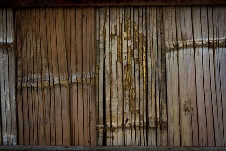 Wood vertical old. Reclaimed Old Wood Slats Rustic shabby Background. Home Interior Design Element In Modern Vintage Style. Hardwood Dark Brown Timbered Structure. Close Upの写真素材