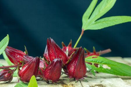 Glass of cold roselle juice - healthy food against woodの写真素材