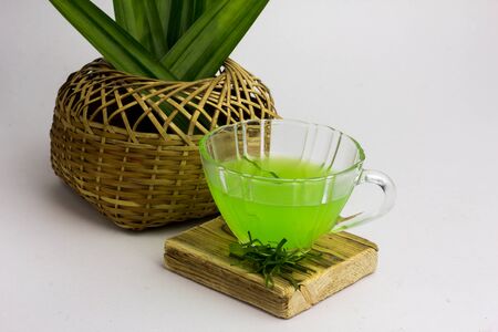 Glass of cold Pandan juice - healthy food against wood,
With pandan green
on a white backgroundの写真素材