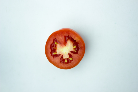 Tomato slice isolated on white background, top view.の写真素材