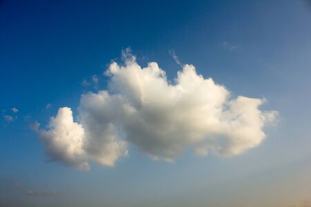 Clouds in the sky are light yellow below the image,Feels soft.