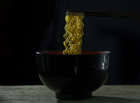 Eat hot noodles, black backdrop,Instant noodles delicious black backdrop.の写真素材