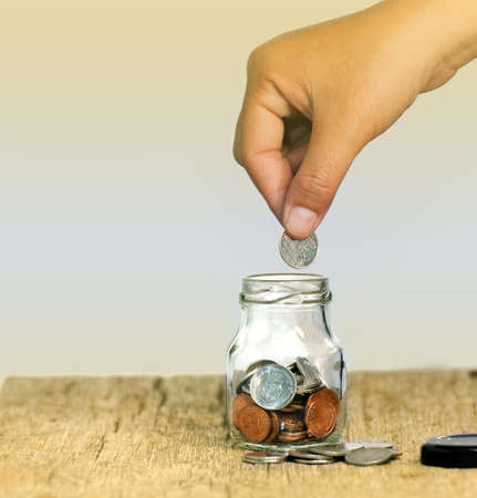 Saving money in a bottle.の写真素材