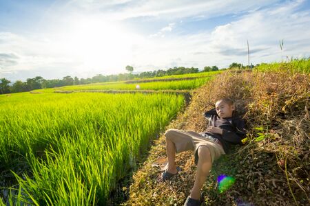 PHOP PHRA,TAK/THAILAND - September 20:An unidentified child Sleeping in rice fields on September 20,2017 in PHOP PHRA,TAK/THAILAND.の写真素材