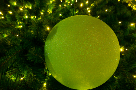 Christmas tree decorated with yellow lights.の写真素材