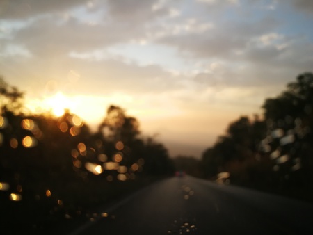 In the car while the rain is falling,In the mirror there is a drop of water.の写真素材
