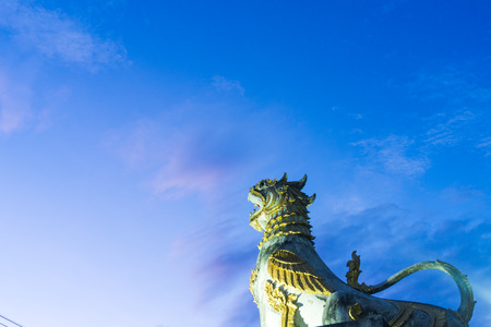 Singing statue in the blue sky at dawn.の写真素材