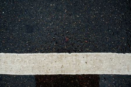 Stripes on the road in the rainy season.の写真素材