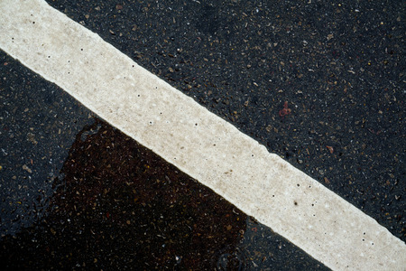 Stripes on the road in the rainy season.の写真素材