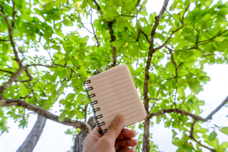 Hold a notebook with a pencil.  With space for text input